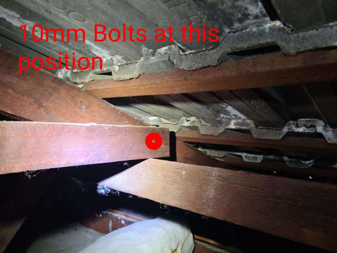 Missing Roof Bracing and Tiedowns — real structural defect photographed in a SURE Building Inspections report