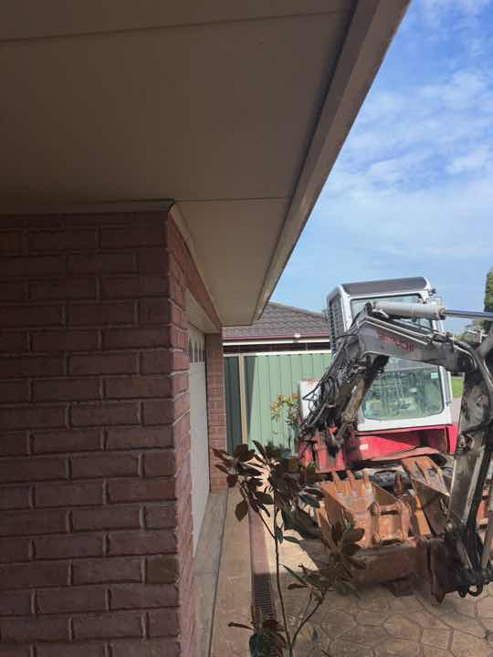 Sagging/Uneven Eave Sections — real structural defect photographed in a SURE Building Inspections report