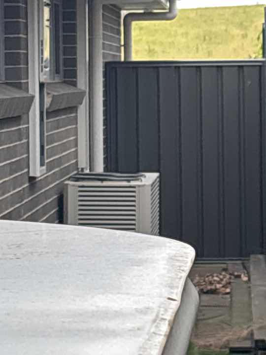 Air Conditioner Overflow Creating Conducive Conditions — real termite defect photographed in a SURE Building Inspections report