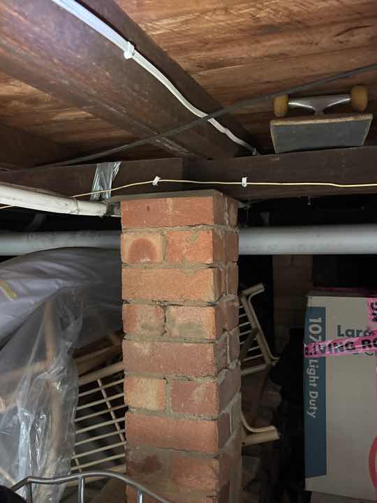 Restricted Sub-floor Access — real compliance defect photographed in a SURE Building Inspections report