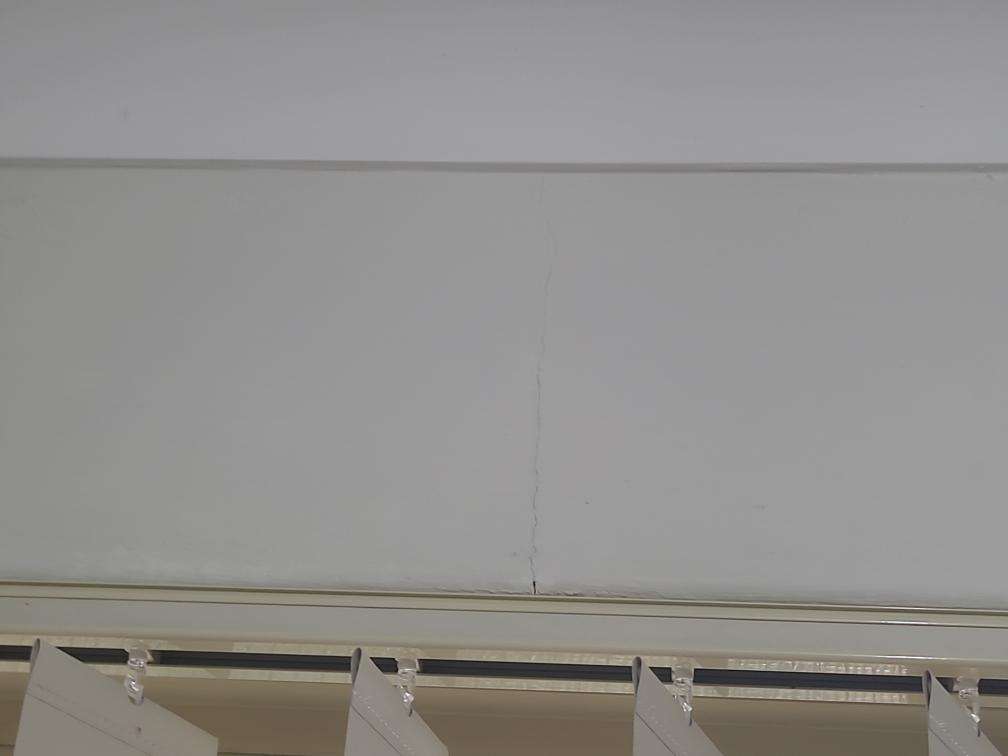 Vanity Water Damage — real moisture defect photographed in a SURE Building Inspections report
