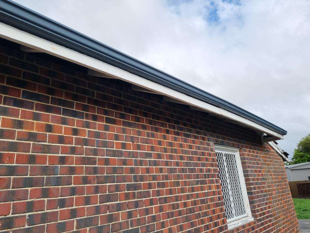 Bowing of Fascia Board — real structural defect photographed in a SURE Building Inspections report