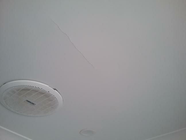 Ceiling Crack — real structural defect photographed in a SURE Building Inspections report