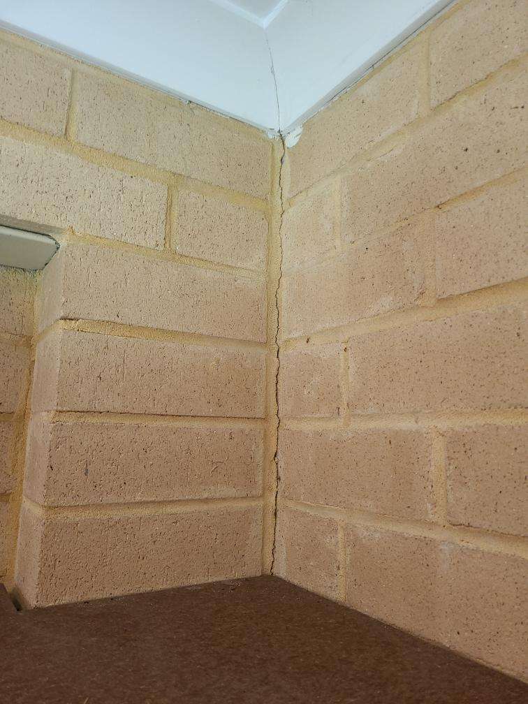 Internal Wall Cracking (Structural Minor) in Multiple Rooms — real structural defect photographed in a SURE Building Inspections report