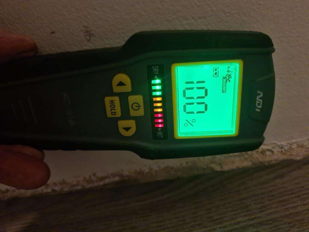 Excess Moisture in Walls Adjacent to Wet Areas — real moisture defect photographed in a SURE Building Inspections report