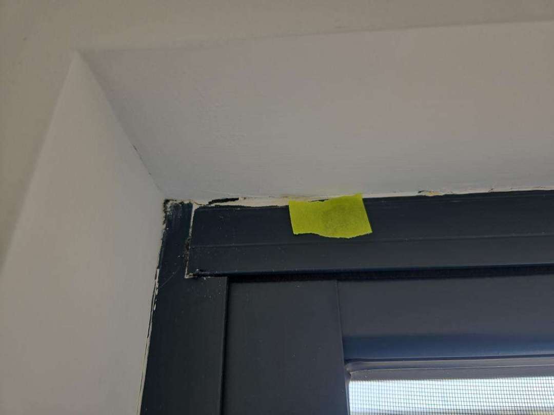 Loose External Door Frame — real finishes defect photographed in a SURE Building Inspections report
