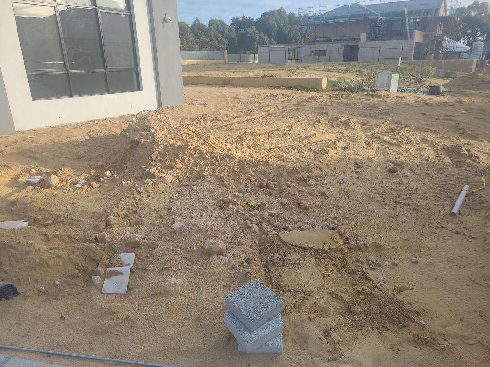 Uncompleted Landscaping — real finishes defect photographed in a SURE Building Inspections report