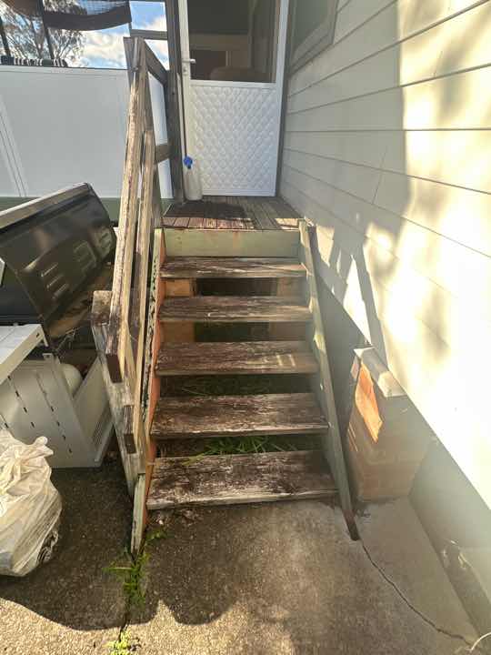 Timber Fungal Decay in Stair Stringers — real moisture defect photographed in a SURE Building Inspections report