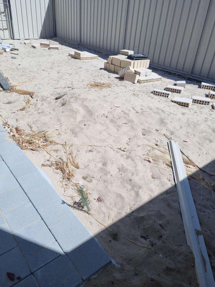 Uncompleted Landscaping — real finishes defect photographed in a SURE Building Inspections report