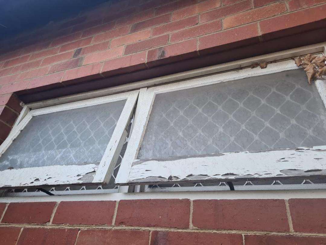 Aged/Damaged Exterior Window Components — real finishes defect photographed in a SURE Building Inspections report