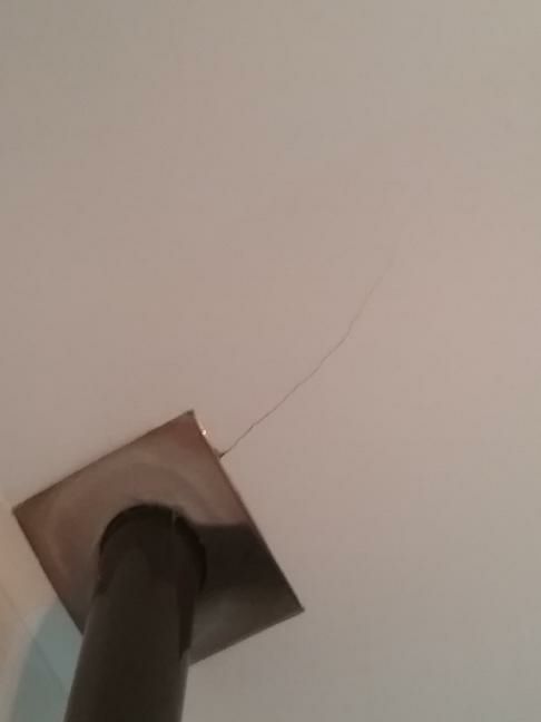Ceiling Crack — real structural defect photographed in a SURE Building Inspections report