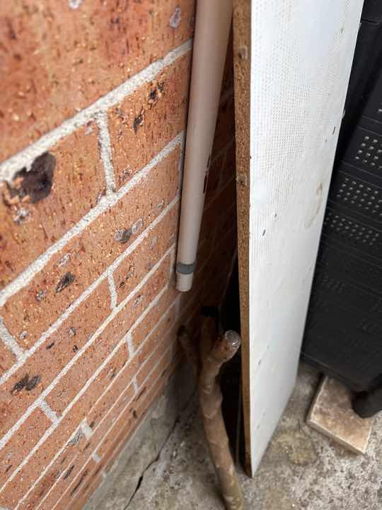 Inadequate Slab Edge Exposure — real soil_foundation defect photographed in a SURE Building Inspections report