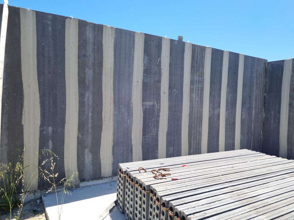 External Wall Panel Protruding from Plumb Line — real structural defect photographed in a SURE Building Inspections report