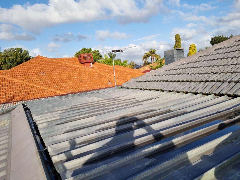 Uneven Roof Line — real structural defect photographed in a SURE Building Inspections report