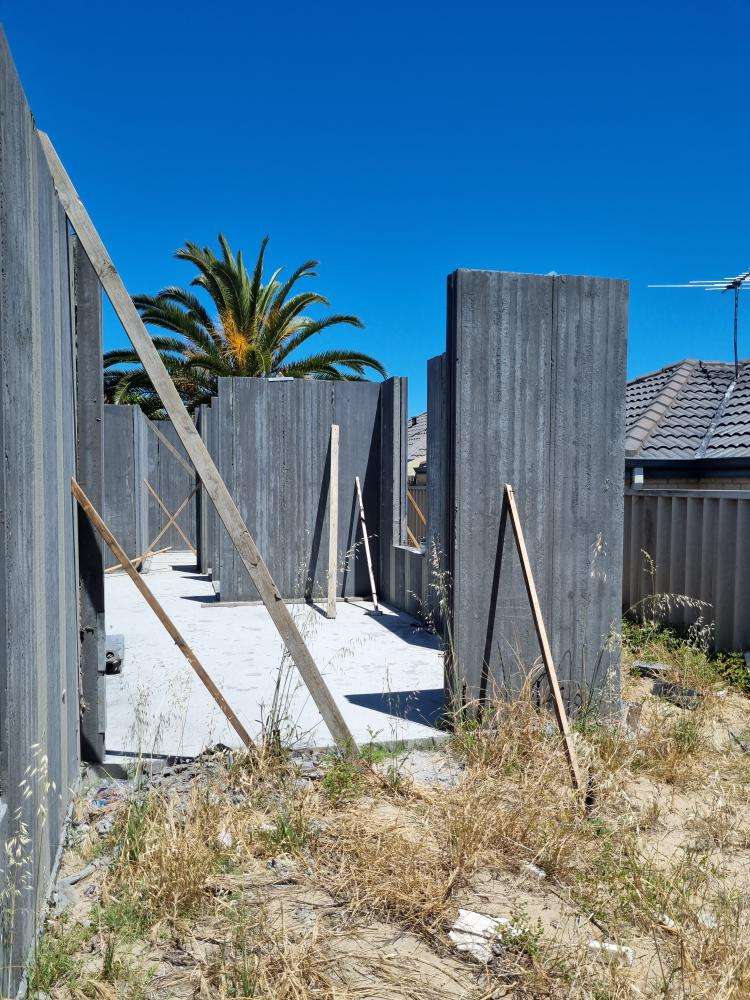 External Wall Panel Protruding from Plumb Line — real structural defect photographed in a SURE Building Inspections report