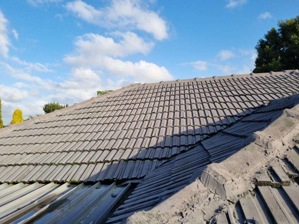 Uneven Roof Line — real structural defect photographed in a SURE Building Inspections report