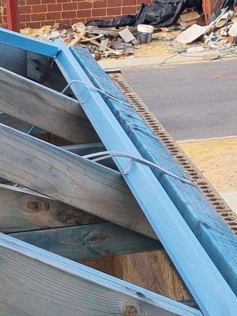 Incomplete Roof Plumbing — real roofing defect photographed in a SURE Building Inspections report