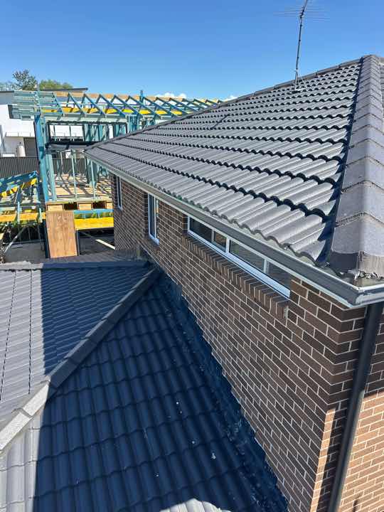 Gutter Ponding — real roofing defect photographed in a SURE Building Inspections report