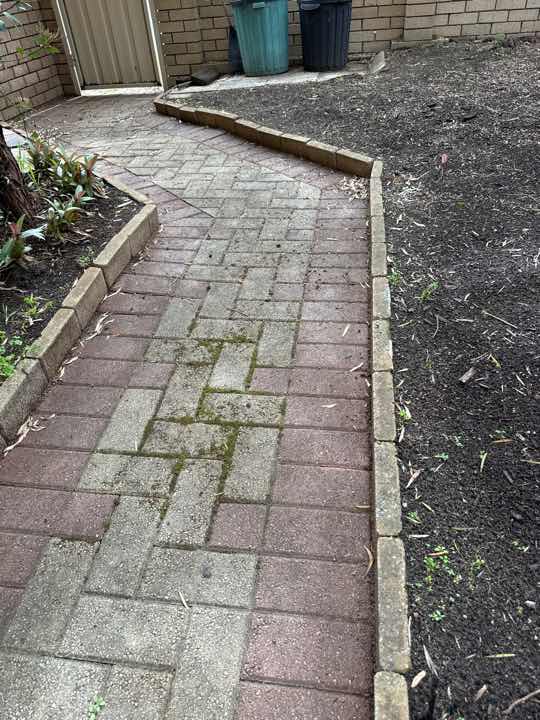 Eroded Mortar in Exterior Brickwork — real finishes defect photographed in a SURE Building Inspections report