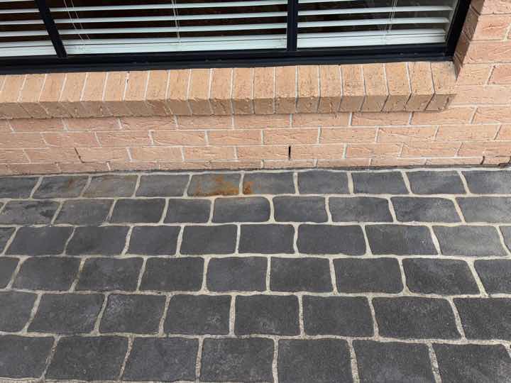 Timber Sleepers as Termite Conducive Conditions — real termite defect photographed in a SURE Building Inspections report