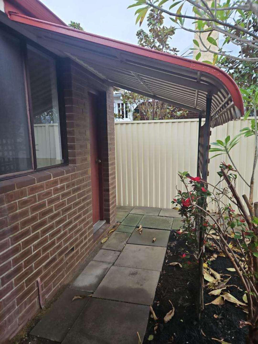 Detached Window Awning with Corrosion — real structural defect photographed in a SURE Building Inspections report