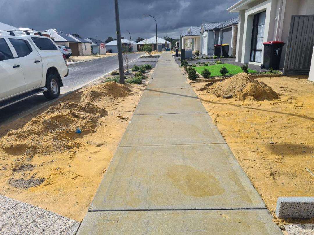 Incomplete Landscaping — real compliance defect photographed in a SURE Building Inspections report