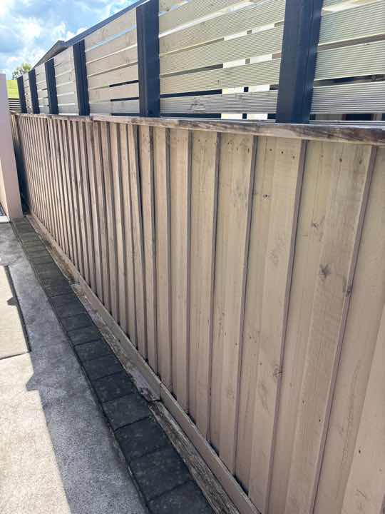 Timber in Contact with Ground — real termite defect photographed in a SURE Building Inspections report