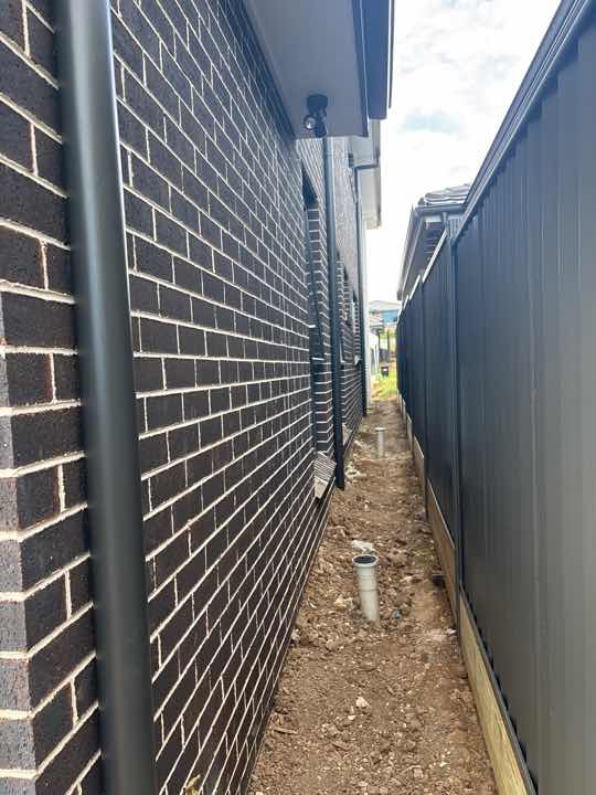 Exterior Walls Require Acid Clean — real finishes defect photographed in a SURE Building Inspections report