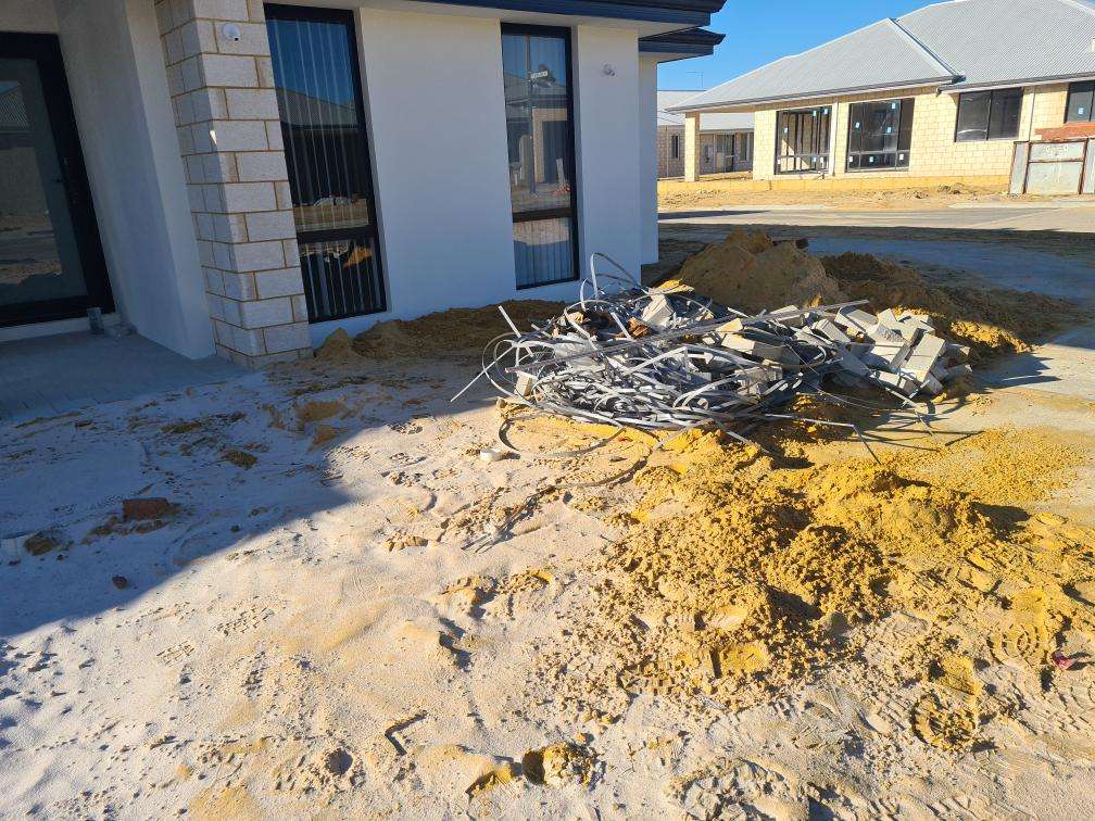 Uncompleted Landscaping — real finishes defect photographed in a SURE Building Inspections report