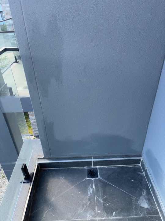 Incomplete Exterior Wall Painting — real finishes defect photographed in a SURE Building Inspections report
