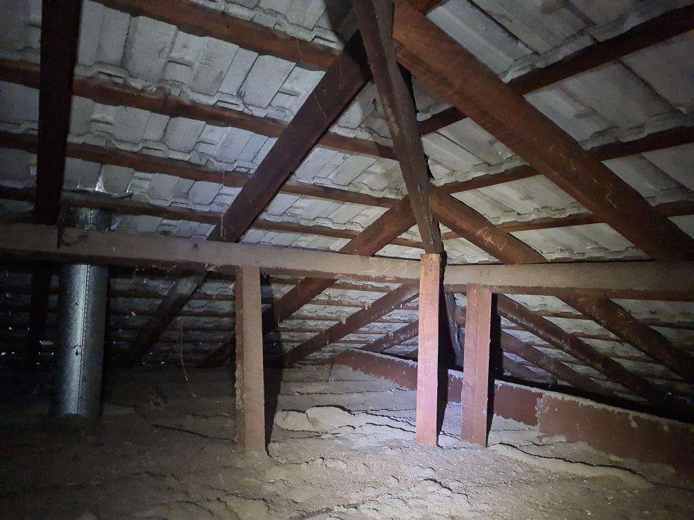 Non-Compliant Roof Framing Sections — real compliance defect photographed in a SURE Building Inspections report
