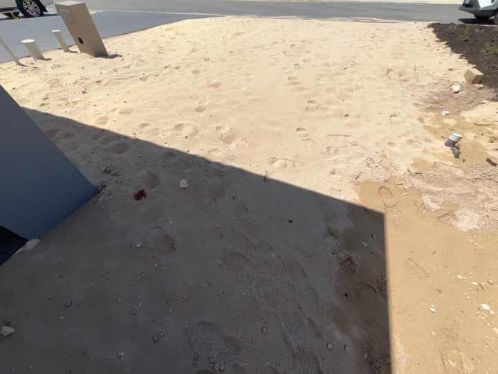 Turf Not Installed — real compliance defect photographed in a SURE Building Inspections report