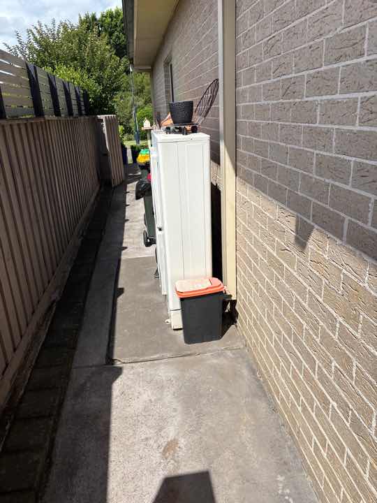 Undrained Air Conditioning Overflow — real moisture defect photographed in a SURE Building Inspections report