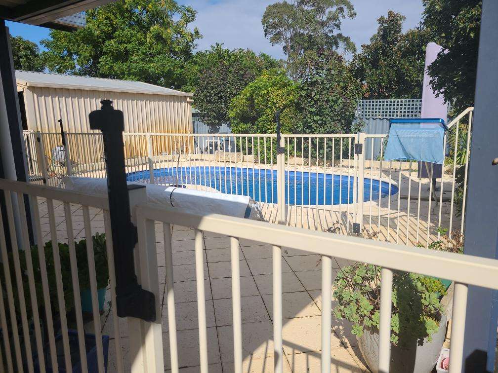 Leaning Fence Sections — real structural defect photographed in a SURE Building Inspections report