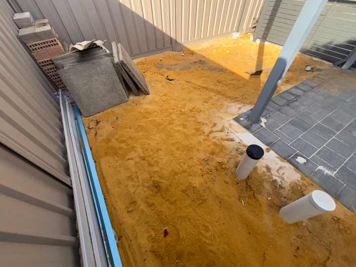 Turf Not Installed — real compliance defect photographed in a SURE Building Inspections report