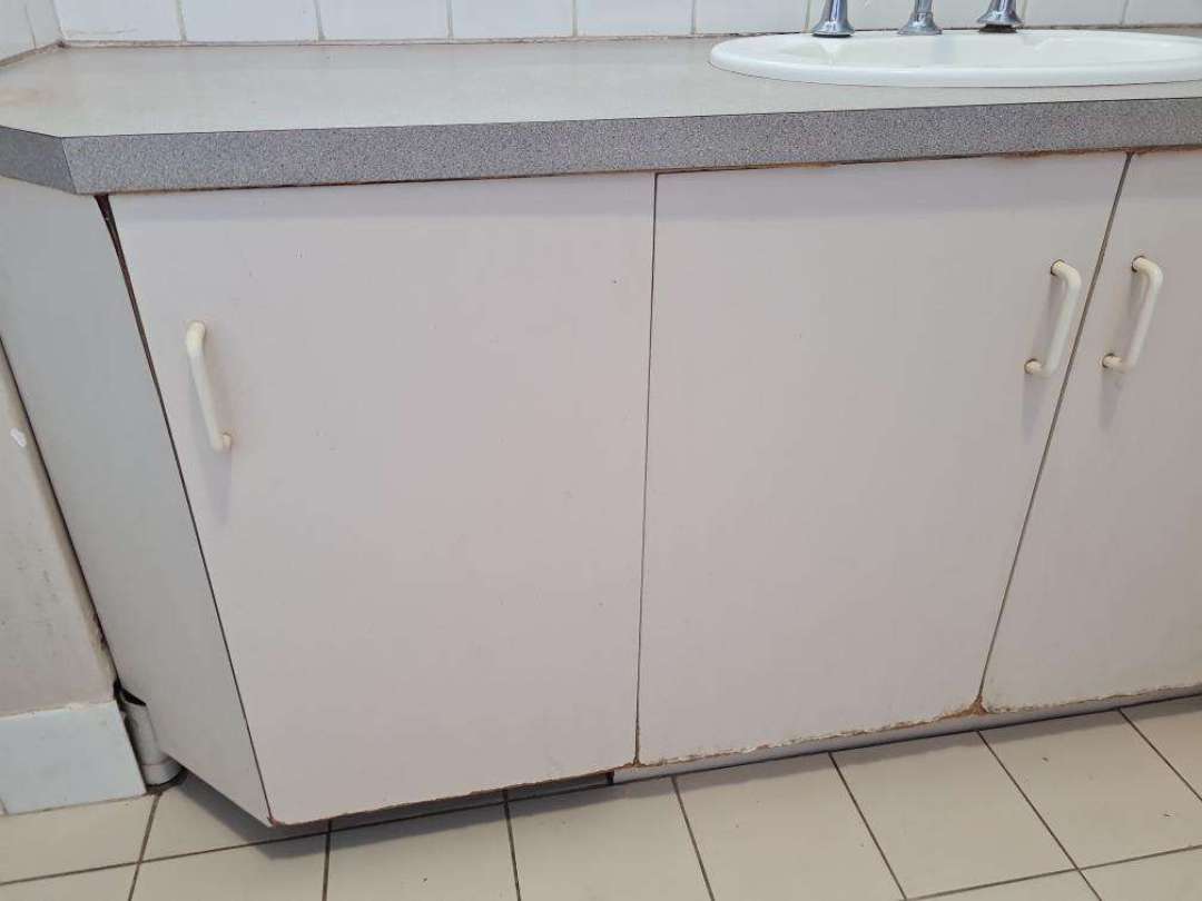 Poor/Deteriorated Splashback Sealant — real finishes defect photographed in a SURE Building Inspections report