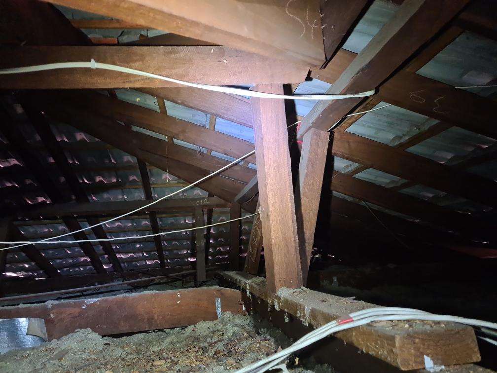 Non-Compliant Roof Framing Sections — real compliance defect photographed in a SURE Building Inspections report
