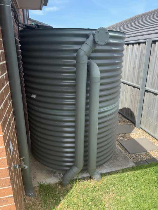 Air Conditioner Overflow Creating Conducive Conditions — real termite defect photographed in a SURE Building Inspections report
