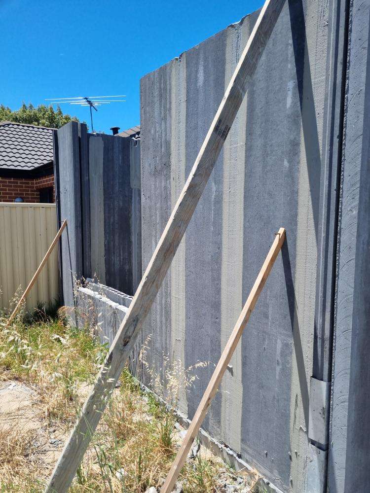 External Wall Panel Protruding from Plumb Line — real structural defect photographed in a SURE Building Inspections report