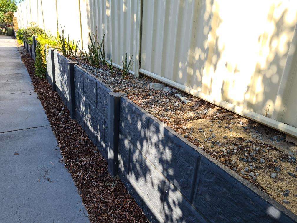Deteriorated Exterior Render — real moisture defect photographed in a SURE Building Inspections report