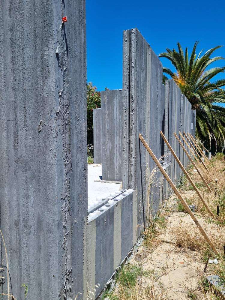 External Wall Panel Protruding from Plumb Line — real structural defect photographed in a SURE Building Inspections report