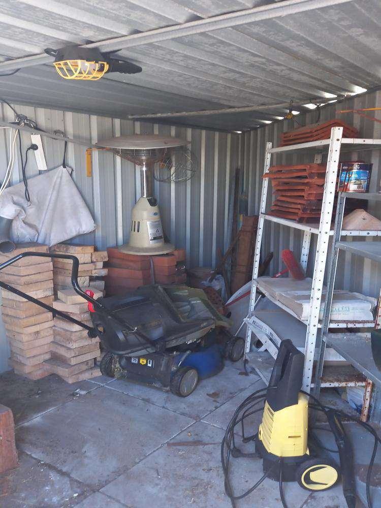 Shed Door Rollers Require Replacement — real compliance defect photographed in a SURE Building Inspections report