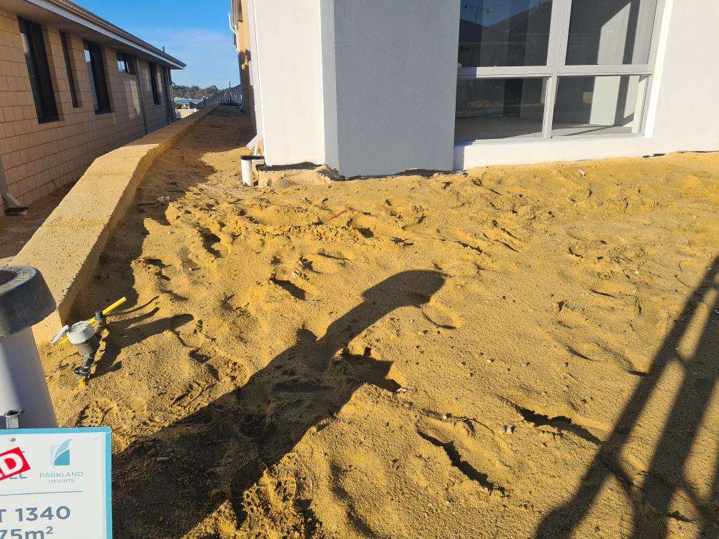 Uncompleted Landscaping — real finishes defect photographed in a SURE Building Inspections report