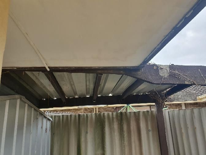 Unstable Decking Posts — real structural defect photographed in a SURE Building Inspections report